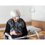 Elderly woman receiving unwanted calls